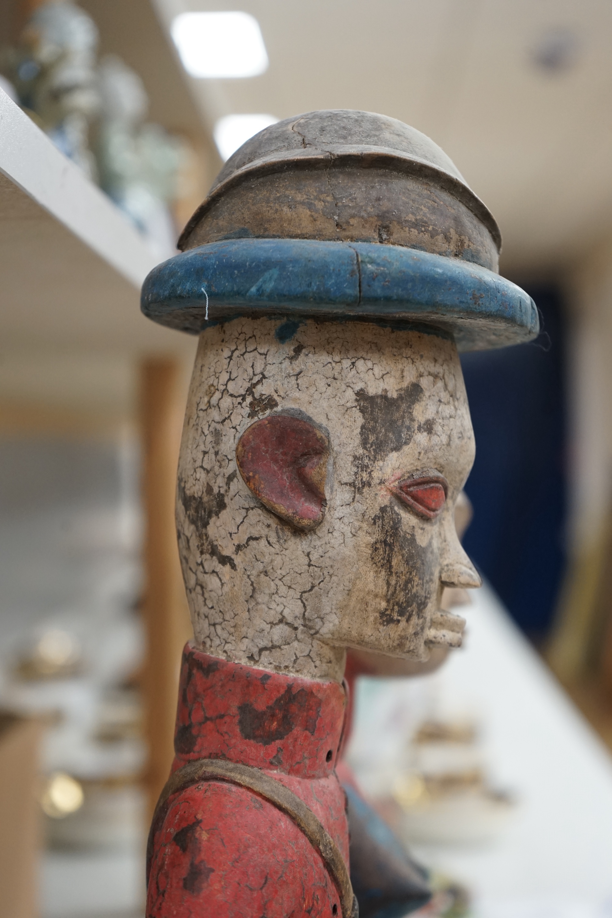 A 20th century West African carving of a colonial military figure and another similar, largest 48cm high. Condition - largest figure chipped